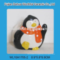 Simple ceramic napkin holder with penguin design